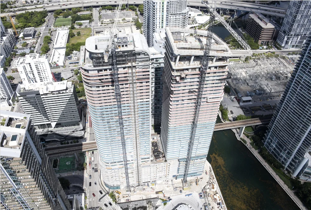 Newgard Group and Two Roads Development Mark Major Construction Milestone at One Brickell Riverfront With Installation of Architectural Crowns