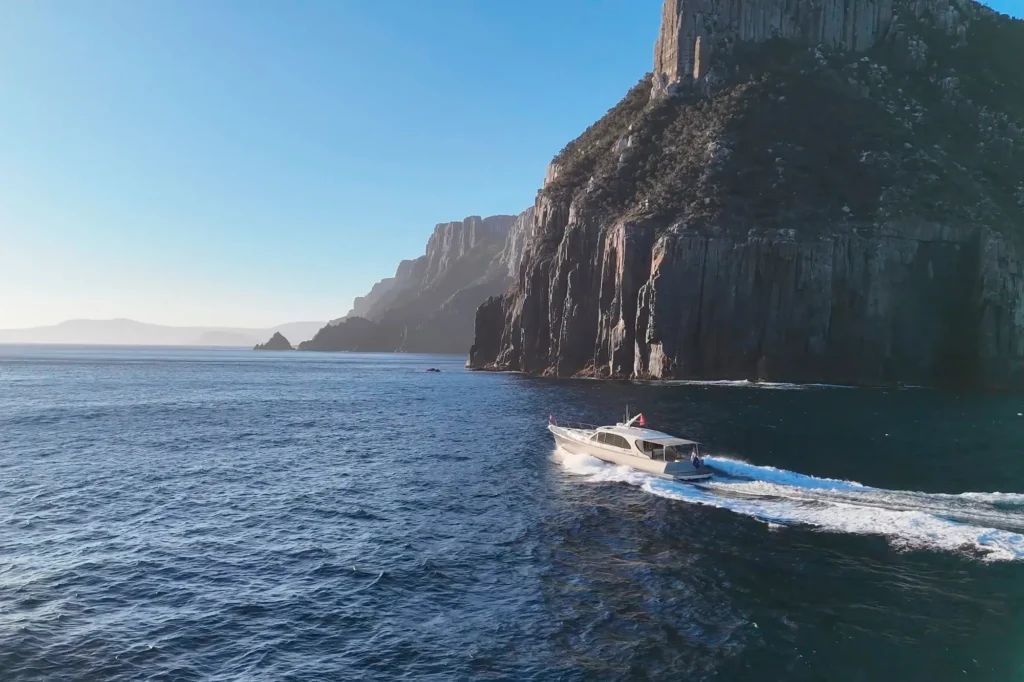 A Palm Beach PB 65 Shadows the Sydney Hobart Race Fleet