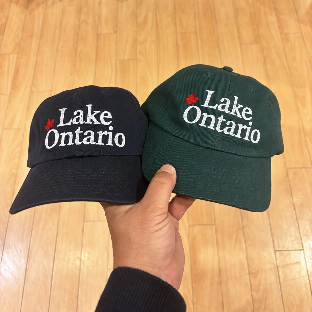 Team Lake Ontario, or team Lake America? There’s a hat for both camps